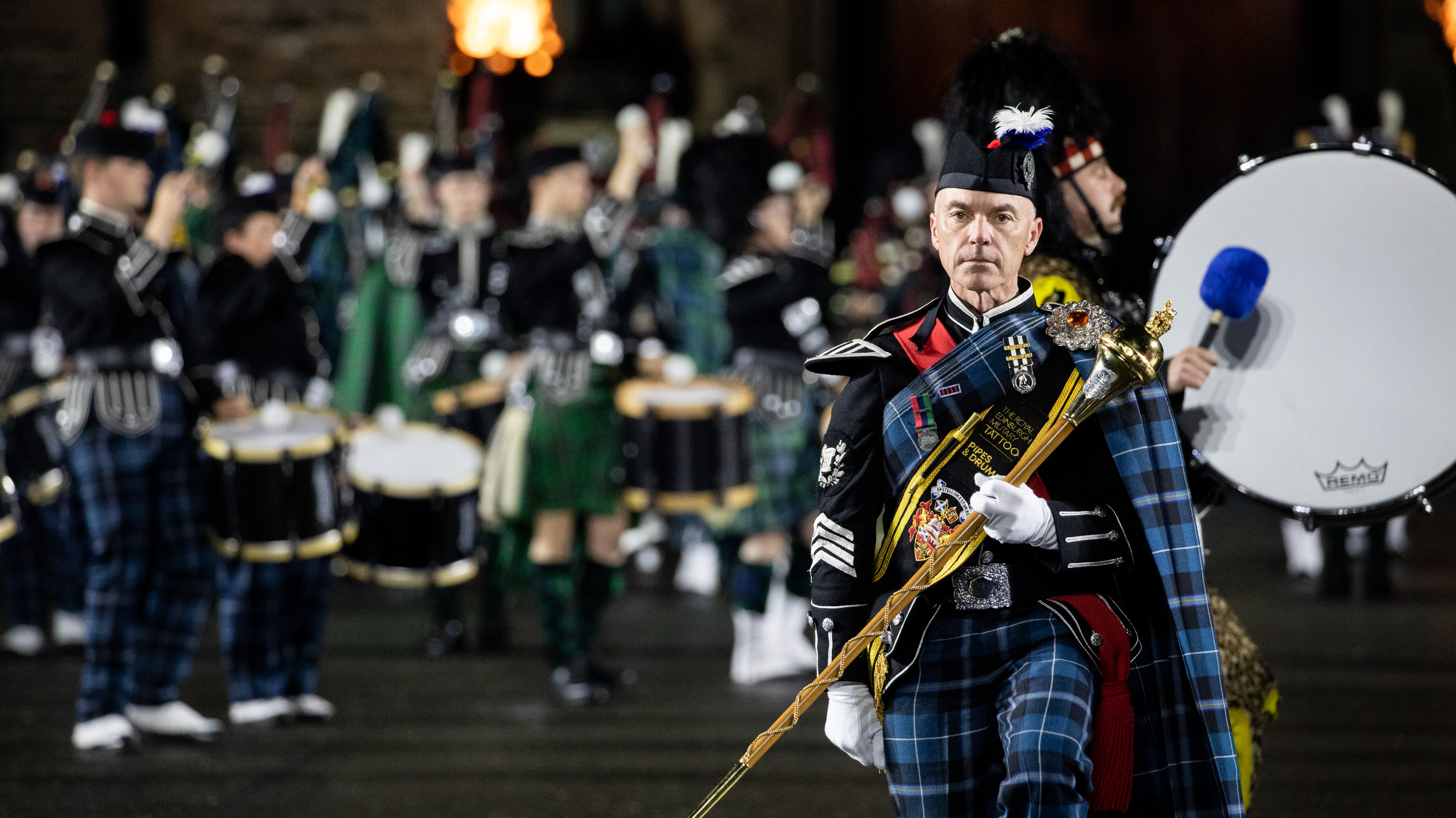 Image shows Band performing in Scottish tartans.